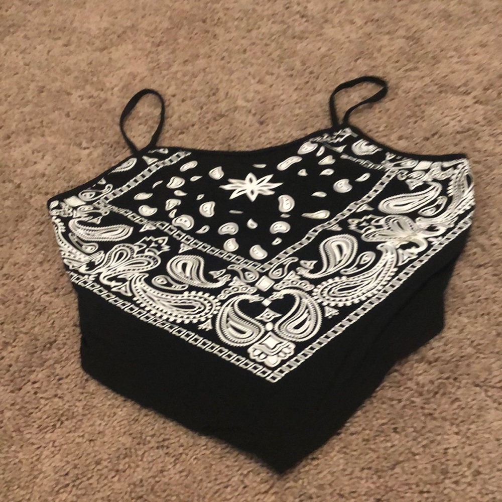 This is a black and white tank top in a xL in woman’s and it’s from SHEIN